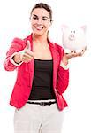 Business woman holding a piggy bank and doing thumbs up, isolated over a white background