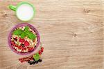 Healthy breakfast with muesli and milk. View from above on wooden table with copy space