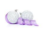 Christmas baubles and purple ribbon. Isolated on white background