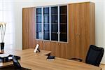 desk and leather chairs in a modern office