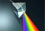 The crystal prism disperses white light into many colors.