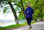 Young Beautiful Woman Running in the Autumn Park. Active Lifestyle