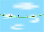 Clothespins on green rope and blue sky