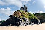 old historic castle on a cliff edge over the beach in Ballybunion county Kerry Ireland