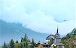 Summer cloudy mountain village landscape (Alps, Switzerland)