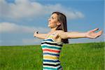 Young and beautiful woman feeling the nature