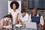 Concentrated creative business team in meeting at office