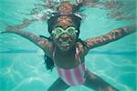 Cute kid posing underwater in pool at the leisure center