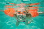 Cute kid posing underwater in pool at the leisure center