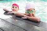 Cute little girls in the swimming pool at the leisure center