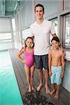 Swimming coach with his students at the leisure center