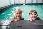 Little boys smiling in the pool at the leisure center