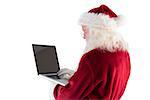 Santa Claus uses a laptop on white background