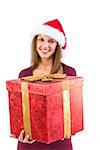Young woman giving a christmas present with bow on white background