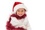 Cute little girl wearing santa hat and tinsel on white background