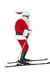 Festive father christmas skiing on white background