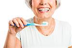 Portrait of a happy old woman brushing her teeth