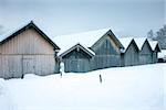 An image of a some huts in the snow