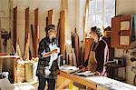 Two craftswomen drinking coffee in pipe organ workshop