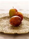 Victoria plums on decorative plate, close-up