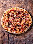 Italian spicy chicken pizza with red chillies, red onion and mozzarella
