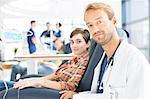 Portrait of doctor and patient undergoing medical treatment in outpatient clinic