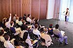 Mid adult businesswoman giving presentation in conference room