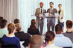 Business people giving presentation in conference room