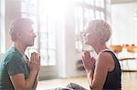 Older couple meditating