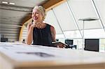 Businesswoman using digital tablet in office