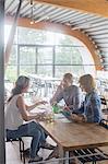 Business people talking in cafeteria