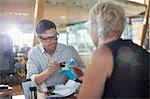 Business people eating at office desk