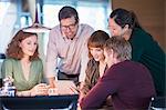 Business people using digital tablet in office meeting