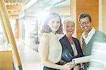 Business people smiling in office