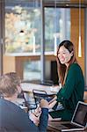 Business people talking at office desk