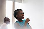 Smiling university student in blue top at seminar