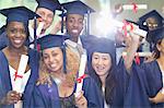 Portrait of university students standing in corridor after graduation ceremony