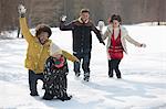 Friends enjoying snowball fight