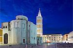 Croatia, Zadar Region, Zadar. Roman ruins in front of the Church of St. Donatus and the cathedral of Anastasia. Completed in the 9th Century on the ruin of the old Roman forum, the Church is the largest pre-Romanesque building in Croatia.