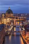 Berlin Cathedral, Berliner Dom, seen fom the Fischerinsel at dusk, the river Spree in the foreground.