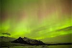 Iceland, Fjallsarlon. The Northern Lights appearing in the sky at Fjallsarlon, a glacier lake at the southern end of the Icelandic glacier of Vatnajokull.