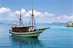 Indonesia, Lesser Sunda Islands. A yacht anchored off Flores Island.
