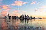 Qatar, Doha. Cityscape at sunrise from the Corniche
