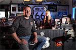 Owner Peter Fischer with Angelina, Eagle Rider Harley store and shop on route 66, Arizona, USA