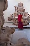 Monk looking at relics at Cham Museum, Da Nang, Vietnam