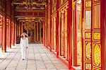 Woman wearing Ao Dai dress in Imperial Palace inside Citadel, Hue, Thua Thien-Hue, Vietnam (MR)
