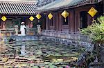 Woman wearing Ao Dai dress at Dien Tho inside Citadel, Hue, Thua Thien-Hue, Vietnam (MR)