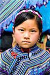 Vietnam, Bac Ha. Portrait of girl from Flower Hmong tribe with traditional dress (MR)