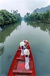 Vietnam, Perfume river. Young vietnamese girls on a boat going to the Perfume pagoda (MR)