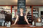 Portrait of female shop assistant in country store cafe